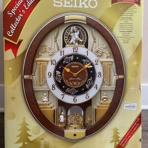 Seiko Brown and Gold Ornate Clock with Oval Shape and Intricate Designs